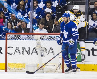 Toronto Maple Leafs Roman Polak reacts as Boston Bruins David Krejci (back left) and Jake DeBrusk celebrate a goal during third period playoff action in Round 1 Game 4 at the Air Canada Centre in Toronto, Ont. on Thursday April 19, 2018. Ernest Doroszuk/Toronto Sun/Postmedia Network