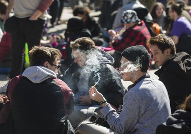 Smoke fills the air at a cannabis themed gathering at 420 Toronto 2018 at Nathan Phillips Square in Toronto, Ont.  on Friday April 20, 2018. Ernest Doroszuk/Toronto Sun/Postmedia Network