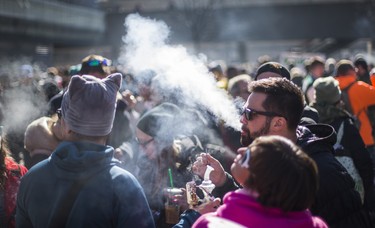 Smoke fills the air at a cannabis themed gathering at 420 Toronto 2018 at Nathan Phillips Square in Toronto, Ont.  on Friday April 20, 2018. Ernest Doroszuk/Toronto Sun/Postmedia Network