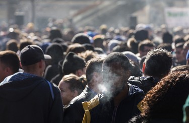 Smoke fills the air at a cannabis themed gathering at 420 Toronto 2018 at Nathan Phillips Square in Toronto, Ont.  on Friday April 20, 2018. Ernest Doroszuk/Toronto Sun/Postmedia Network