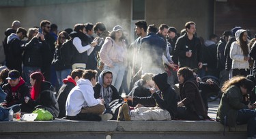 Smoke fills the air at a cannabis themed gathering at 420 Toronto 2018 at Nathan Phillips Square in Toronto, Ont.  on Friday April 20, 2018. Ernest Doroszuk/Toronto Sun/Postmedia Network