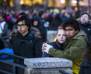 People embrace at the #TorontoStrong Vigil at Mel Lastman Square in Toronto, Ont. on Sunday April 29, 2018. The event brought people together following the van attack that left 10 people dead. Ernest Doroszuk/Toronto Sun/Postmedia Network