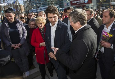 Canadian Prime Minister Justin Trudeau and Toronto Mayor John Tory wait to sign a book of condolence at a memorial at Olive Square - in memory of the 10 people killed in the van attack - before going to the #TorontoStrong Vigil at Mel Lastman Square in Toronto, Ont. on Sunday April 29, 2018. Ernest Doroszuk/Toronto Sun/Postmedia Network