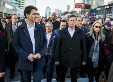 Canadian Prime Minister Justin Trudeau and Toronto Mayor John Tory make their way on Yonge St. to the #TorontoStrong Vigil at Mel Lastman Square in Toronto, Ont. on Sunday April 29, 2018. The event brought people together following the van attack that left 10 people dead. Ernest Doroszuk/Toronto Sun/Postmedia Network