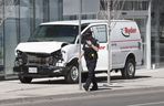 A damaged white Ryder van is seen after the attack that killed 10 pedestrians on April 23, 2018 in north Toronto.