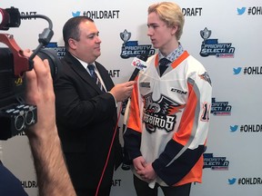 Evan Vierling, selected second overall by the Flint Firebirds in the OHL draft, is interviewed by webcast host Terry Doyle at OHL headquarters in Toronto on April 7, 2018