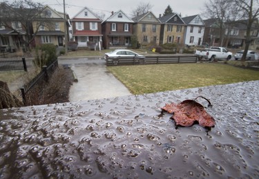 Ice from freezing rain starts to form on a railing in Toronto on Saturday April 14, 2018. Environment Canada has issued a weather warning that up to 20mm or ice build up is possible. THE CANADIAN PRESS/Frank Gunn