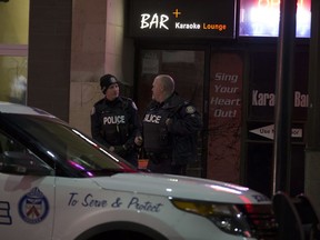 Toronto Police outside Karaoke Bar on Yonge St., near Gerrard St., above a Swiss Chalet, where a shooting took place early Tuesday, April 3, 2018. (John Hanley photo)