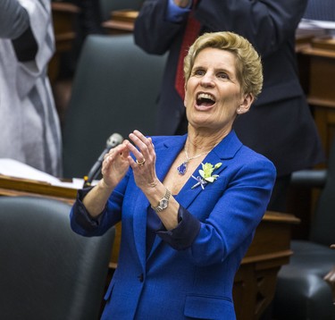 Ontario Premier Kathleen Wynne applauds while Ontario Finance Minister Charles Sousa (not pictured) delivers the provincial budget at the Ontario Legislature in Toronto, Ont. on Wednesday March 28, 2018. Ernest Doroszuk/Toronto Sun/Postmedia Network ORG XMIT: POS1803281656141719