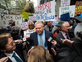 Ontario Progressive Conservative leader Doug Ford holds a rally to speak about Hydro One in Toronto on Tuesday, May 15, 2018. THE CANADIAN PRESS/Aaron Vincent Elkaim ORG XMIT: AVE101