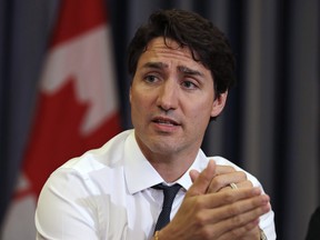 Prime Minister Justin Trudeau gestures during a roundtable discussion with members of the Canadian Technology Accelerator in Cambridge, Mass., Thursday, May 17, 2018. (AP Photo/Charles Krupa)