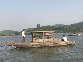 West Lake in Hangzhou, China, is a popular holiday destination for locals who flock here to enjoy its many gardens or take boat tours.