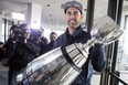 Toronto Argonauts quarterback Ricky Ray holds the Grey Cup as speaks to members of the media as the teams returns to Toronto on Monday, November 27 2017. After a celebration that lasted into the wee hours, a tired group of Toronto Argonauts arrived home Monday morning with the Grey Cup in tow. THE CANADIAN PRESS/Chris Young ORG XMIT: CHY105 ORG XMIT: POS1711271117301827