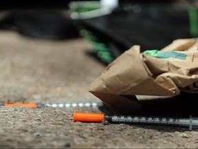 Needles and trash near the safe injection site at Dundas and Victoria Sts. (Dave Abel, Toronto Sun)