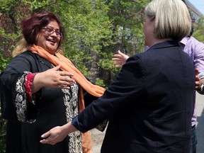 NDP Leader Andrea Horwath greets candidate Tasleem Riaz during a campaign stop on May 31. Riaz had a Hitler meme on her Facebook page. She denies posting it. (DAVE ABEL, Toronto Sun)