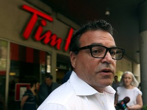 Councillor Giorgio Mammoliti speaks out against a safe-injection site at Dundas and Victoria Sts. (Dave Abel, Toronto Sun)