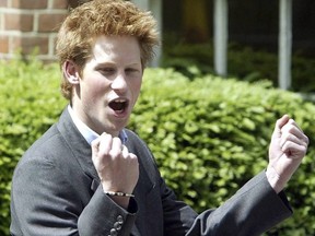 In this June 12, 2003 file photo, Prince Harry, 18, punches the air as he leaves Eton College on his last day at the top public school. (AP PHOTO)