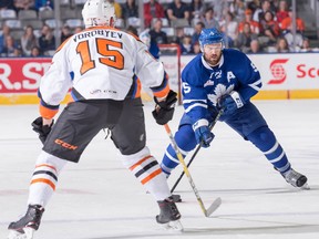 Andreas Borgman (right) of the Toronto Marlies battles with Mikhail Vorobyev of the Lehigh Valley Phantom during a game at Ricoh Coliseum on May 20, 2018. (Christian Bonin Photo)