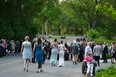 Stratford Festival patrons head toward the Avon River in their opening night finery after an "explosives threat" forced the evacuation of both the Festival and Avon theatres Monday. Galen Simmons/Postmedia Network
