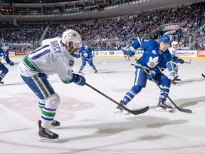 Marlies defenceman Andrew Nielsen tries to prevent Uticas Cam Darcy from centring a pass during Game 5 of their first-round AHL series. Christian Bonin photo).