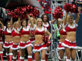Houston Texans Cheerleaders perform before the Denver Broncos played the Houston Texans at Reliant Stadium on December 22, 2013 in Houston, Texas. (Bob Levey/Getty Images)