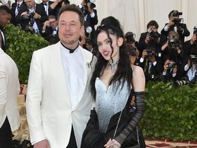 Elon Musk and Grimes attend the Heavenly Bodies: Fashion & The Catholic Imagination Costume Institute Gala at Metropolitan Museum of Art on May 7, 2018 in New York City.