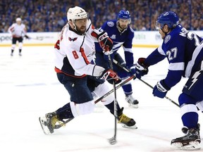Alex Ovechkin #8 of the Washington Capitals takes a shot against Ryan McDonagh #27 of the Tampa Bay Lightning during the third period in Game Five of the Eastern Conference Finals during the 2018 NHL Stanley Cup Playoffs at Amalie Arena on May 19, 2018 in Tampa, Florida.