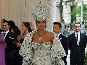 Rihanna arrives for the 2018 Met Gala on May 7, 2018, at the Metropolitan Museum of Art in New York. The Gala raises money for the Metropolitan Museum of Arts Costume Institute. The Gala's 2018 theme is Heavenly Bodies: Fashion and the Catholic Imagination.