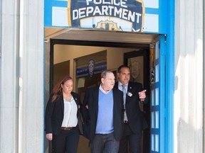 Harvey Weinstein (C) leaves the New York City Police Department's First Precinct on May 25, 2018 in New York in handcuffs after he was charged with rape and other sex crimes involving two separate women. (BRYAN R. SMITH/AFP/Getty Images)