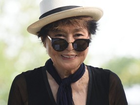 (FILES) This file photo taken on July 29, 2015 shows Yoko Ono looking on during a dedication ceremony for a giant tapestry, from Amnesty International, in honor of John Lennon on Ellis Island in New York. Nearly half a century after John Lennon released "Imagine," his widow and artistic collaborator Yoko Ono will be listed as a co-writer. The announcement was made as the iconic 1971 ode to world peace was declared "song of the century" at a gala June 14, 2017 in New York of the National Music Publishers Association.  / AFP PHOTO / Don EMMERTDON EMMERT/AFP/Getty Images