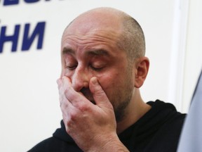 Russian journalist Arkady Babchenko reacts during a news conference at the Ukrainian Security Service on Wednesday, May 30, 2018. Babchenko turned up at a news conference in the Ukrainian capital Wednesday less than 24 hours after police reported he had been shot and killed at his Kiev apartment building.  (AP Photo/Efrem Lukatsky)