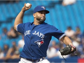 Toronto Blue Jays designated hitter Kendrys Morales pitches during ninth inning American League MLB baseball action against the Oakland Athletics, in Toronto on Sunday, May 20, 2018.