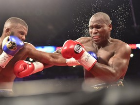 Badou Jack (left) and Adonis Stevenson exchange blows during their WBC light-heavyweight championship boxing match in Toronto on Saturday, May 19, 2018. (THE CANADIAN PRESS/Frank Gunn)