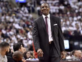 Then Toronto Raptors coach Dwayne Casey smiles during his 61st birthday during second half NBA basketball action against the Washington Wizards, in Toronto on Tuesday, April 17, 2018. THE CANADIAN PRESS/Nathan Denette