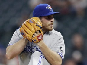 Toronto Blue Jays starting pitcher Joe Biagini winds up during the first inning in the second game of a baseball doubleheader against the Cleveland Indians in Cleveland. (AP Photo/Tony Dejak)