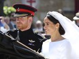 Meghan Markle and Prince Harry leave after their wedding ceremony, at St. George's Chapel in Windsor Castle in Windsor, near London, England, Saturday, May 19, 2018.