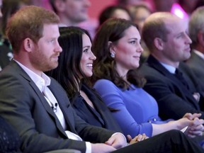 Britain's Prince William and Kate, Duchess of Cambridge, with Prince Harry, left, and his fiancee Meghan Markle, second left, attend the first annual Royal Foundation Forum in London, Wednesday Feb. 28, 2018. Under the theme 'Making a Difference Together', the event will showcase the programmes run or initiated by The Royal Foundation. (Chris Jackson/Pool via AP) ORG XMIT: LBJ131