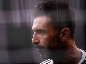 In this file photo taken on October 28, 2017 with a gelatine filter Juventus' goalkeeper Gianluigi Buffon before the Italian Serie A football match AC Milan Vs Juventus at the 'Giuseppe Meazza' Stadium in Milan