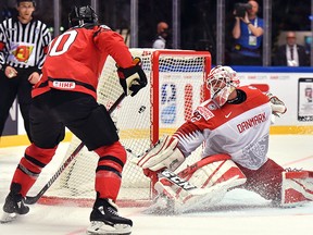 Canada's Ryan O'Reilly scores despite the efforts of Denmark's Sebastian Dahm during the 2018 World Hockey Championship at the Jyske Bank Boxen in Herning, Denmark, on May 7, 2018. (Getty Images)