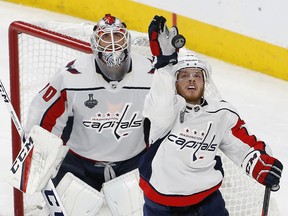Washington Capitals defenceman John Carlson, right, knocks the puck away as goaltender Braden Holtby watches Wednesday, May 30, 2018, in Las Vegas. (AP Photo/Ross D. Franklin)