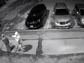 Screengrab of video released by Toronto Police showing two suspects involved in pointing a gun at a man in the Regent Park area.