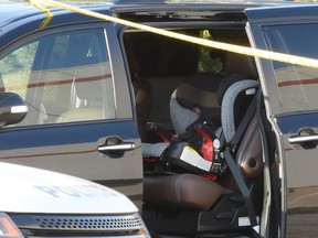 A car seat is visible after a toddler left inside a vehicle died in Burlington on Wednesday, May 23, 2018. (Andrew Collins photo)