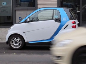 A Car2Go vehicle is parked on a street in central Berlin on Wednesday, Feb. 19, 2014. Car2Go is suspending its Toronto operations at the end of the month because of City of Toronto parking regulations.