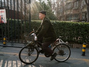 Han Zicheng, 85, rides his bicycle to a nearby market in Tianjin, China, in January.