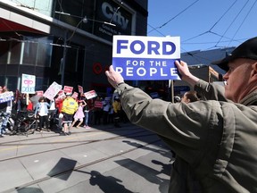 Doug Ford supporters gather outside the City building at Yonge Dundas Square ahead of the Provincial leaders debate in Toronto, Ont. on Monday May 7, 2018. (Dave Abel/Toronto Sun)