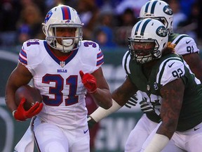 Jonathan Dowling of the Buffalo Bills runs with the ball against the New York Jets at MetLife Stadium on January 1, 2017 in East Rutherford, New Jersey. (Ed Mulholland/Getty Images)