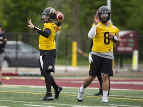 The newest addition to the CFL Hamilton Tiger Cats roster, quarterback Johnny Manziel (2) is seen with teammates on the field at McMaster University during Tiger Cats training camp in Hamilton, Ont., on Sunday, May 20, 2018. The former NFLer and Heisman Trophy winner signed a two-year deal with the Hamilton Tiger Cats to further his career after a long break calling the deal his "best opportunity for me moving forward." THE CANADIAN PRESS/Peter Power ORG XMIT: pmp115