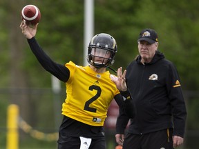 The newest addition to the CFL Hamilton Tiger Cats roster, quarterback Johnny Manziel (2) is seen with teammates on the field at McMaster University during Tiger Cats training camp in Hamilton, Ont., on Sunday, May 20, 2018. Peter Power/The Canadian Press