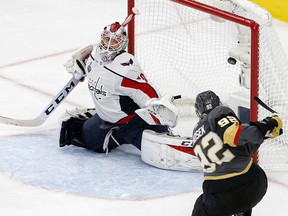 Washington Capitals goaltender Braden Holtby, left, is scored on by Vegas Golden Knights left wing Tomas Nosek during Game 1 of the Stanley Cup final Monday, May 28, 2018, in Las Vegas. (AP Photo/Ross D. Franklin)