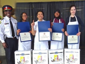 Police Chief Mark Saunders with members of  George Harvey Collegiate Institute, winners of this years Stone Soup competition